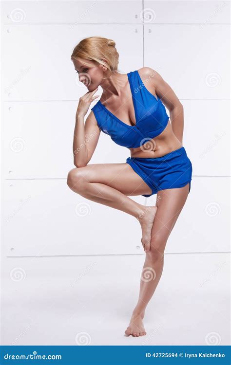 Beautiful Blonde Perfect Athletic Slim Figure Engaged In Yoga Exercise Or Fitness Lead A