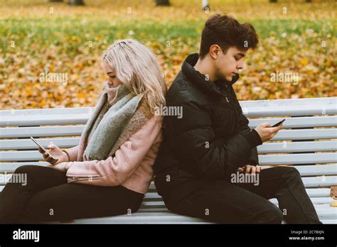 Teenage love concept Cute brunette guy фтв young blonde girl Stock Photo Alamy
