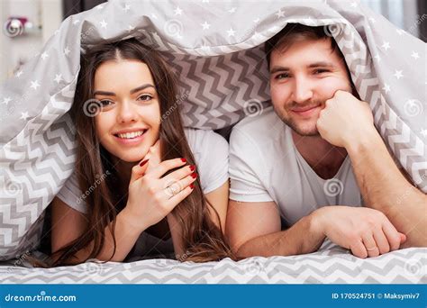 Happy Couple Having Fun In Bed Intimate Sensual Young Couple In