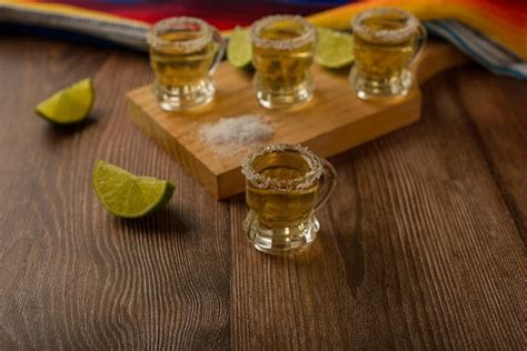 Premium Photo Tequila Shots With Salt And Lime On A Bar Table Shots