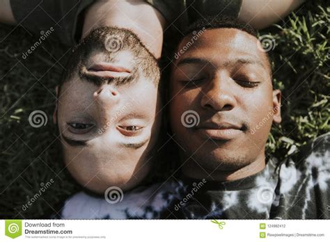 Gay Couple Relaxing In The Grass Stock Photo Image Of Lying Bearded
