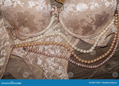 Lace Lingerie And Pearls On A Wooden Board Stock Photo Image Of Panties Object 68674186