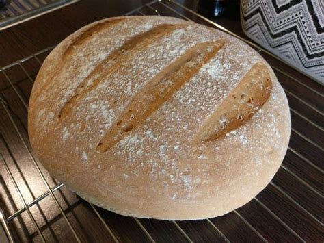 A Loaf Of Bread Sitting On Top Of A Metal Rack