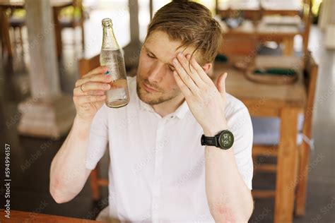 Male Is Refreshing Using A Cold Bottle Of Water Hydration During Heat