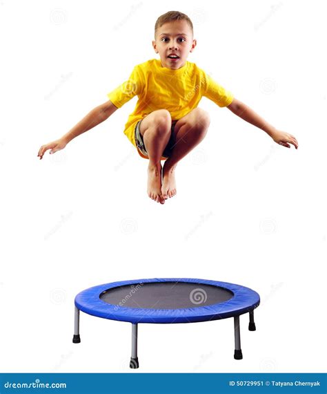 Cute Boy Exercising And Jumping On A Trampoline Stock Photo Image