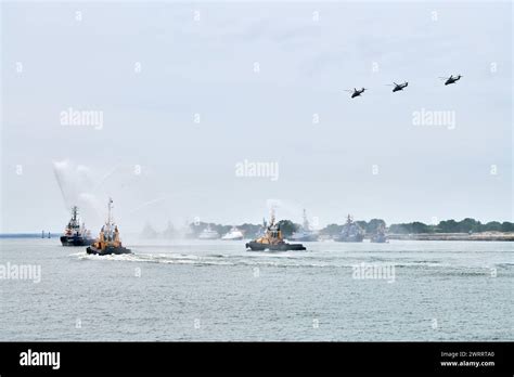 Fireboat sailing along Russian naval forces parade warships with ...