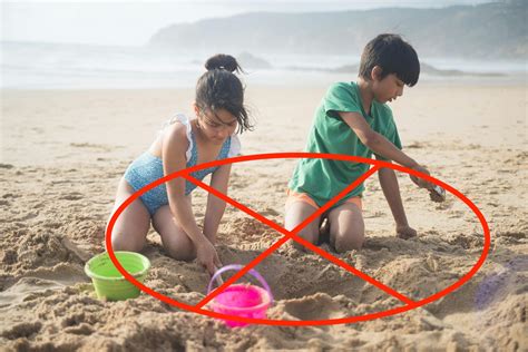 Hidden Dangers Why You Shouldn’t Dig Holes In The Sand On Your Beach Vacation Premium Beach