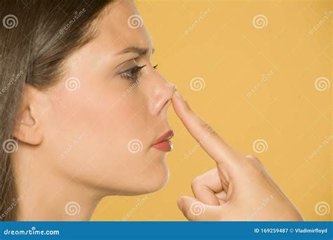 Beautiful Young Woman Touching Her Nose With Her Finger Stock Image Image Of Finger