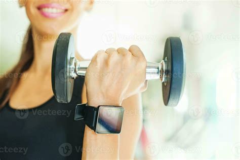 Smart Watch Showing A Heart Rate Of Exercising Woman In Gym