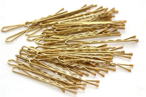 Collection of Gold Hairpins on White Surface Free Stock Photo | FreeImages 