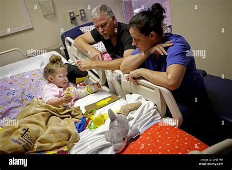 Ireland Nugent 2 Plays With Play Doh At Tampa General Hospital On May 1 2013 With Her Father