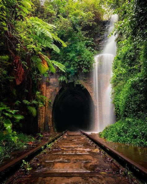 Train Track Tunnel With Waterfall