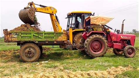 Jcb 3dx Backhoe Machine Working With Mahindra Tractor For Making Pond