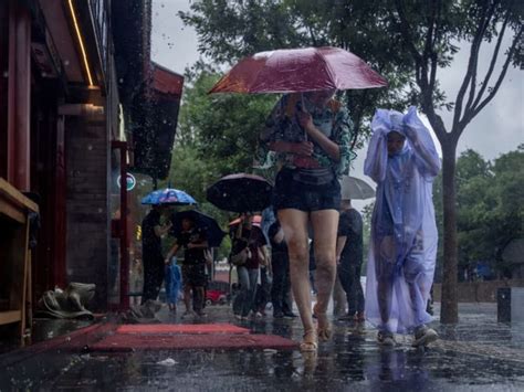 Extreme Rain In Beijing After Typhoon Turns Roads Into Rivers Kills