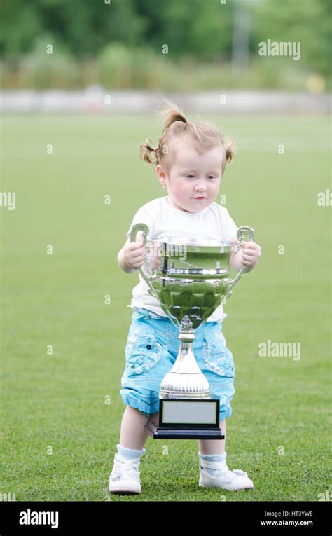 Children holding trophy hi-res stock photography and images - Alamy