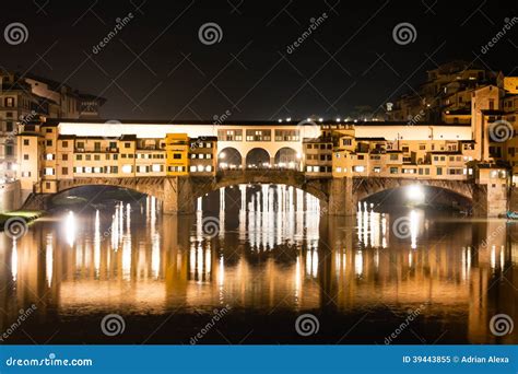 Firenze Ponte Vecchio Old Bridge By Night With Reflections In Stock