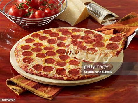 Pepperoni Pizza Cheese Pull Photos and Premium High Res Pictures - Getty Images