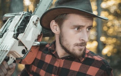 Premium Photo Lumberjack Close Up Portrait Lumberjack With Chainsaw