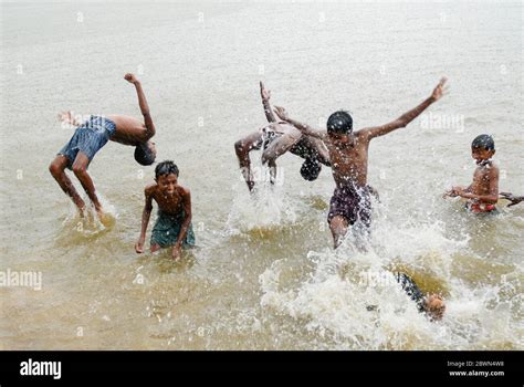 Indian boy bathing in river hi-res stock photography and images - Alamy