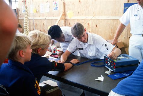 A Hospital Corpsman Seaman Apprentice Takes The Blood Pressure Of