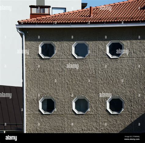 House Facade With Octagonal Windows And Roof With Tiles Stock Photo Alamy