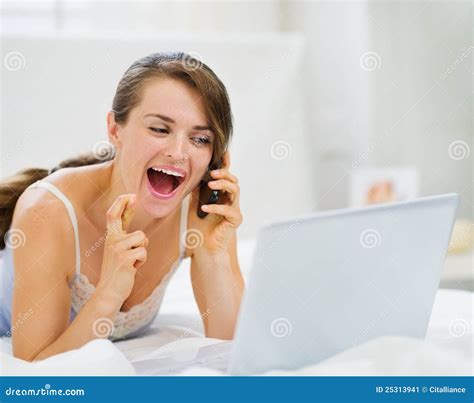 Excited Woman With Laptop Speaking Mobile Stock Image Image Of