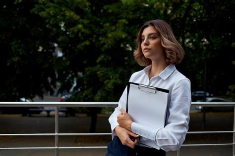 Premium Photo Cheerful Business Woman With Documents In Her Hands On