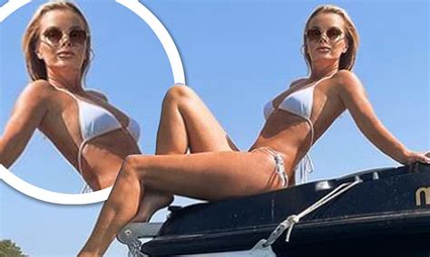 Amanda Holden SIZZLES In Tiny White Bikini While Reclining On The Deck Of A Luxury Boat