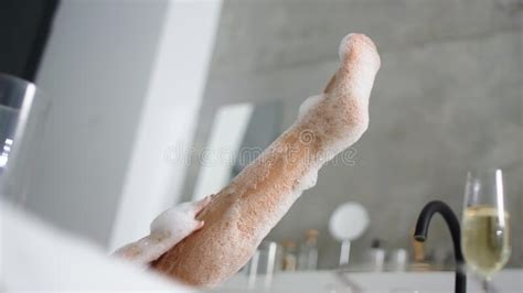 Close Up Woman Feet In Foam Bath Unrecognized Girl Washing Legs In