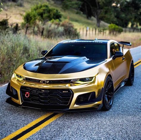 Gold Chevrolet Camaro Driving