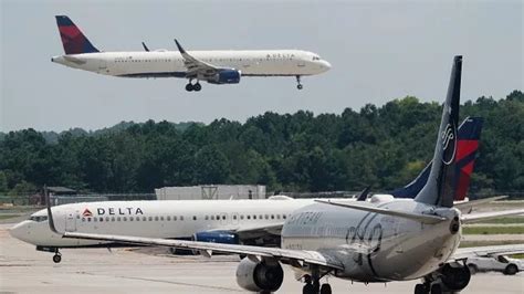 Passengers Evacuate Plane On Slides After Delta Flight Aborts Takeoff