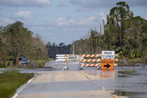 Road Closed for Roadworks and Danger of Flooding with Warning Signs ...