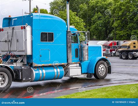 Classic Blue Big Rig Powerful Semi Truck Tractor Moving On The Exit Of