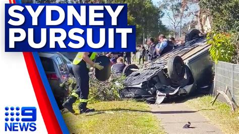 Police Pull Driver From A Car After It Flipped Following A Pursuit In