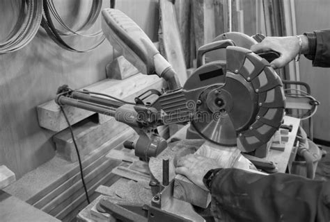 Carpenter Workplace Man Using Circular Saw To Cut Wood Stock Photo