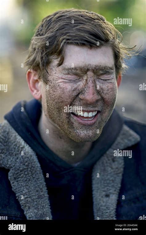 Close Up Of Man Covered By Mud A Man S Face Covered In Muddy Spots