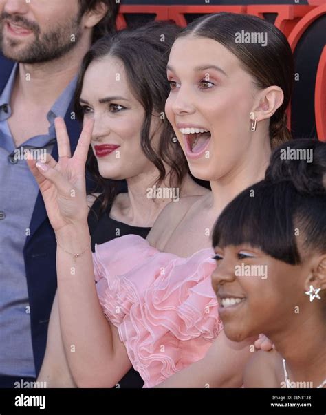 L R Winona Ryder And Millie Bobby Brown At Netflixs Stranger Things