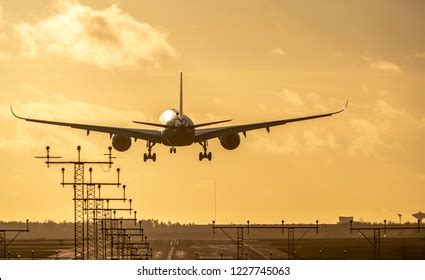 Airplane Landing Airport Runway Sunset Stock Photo Edit Now 1227745063