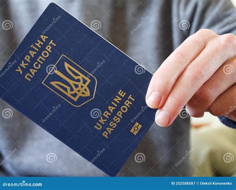 Ukrainian Biometric Passport In The Hand Of Its Owner Stock Image