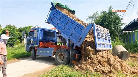 Dump Truck 5T Unloading Soil Filling Up With Bulldozer Komatsu D20p