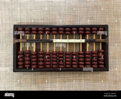 close up of an Abacus - ancient a calculating tool, isolated on a mat
