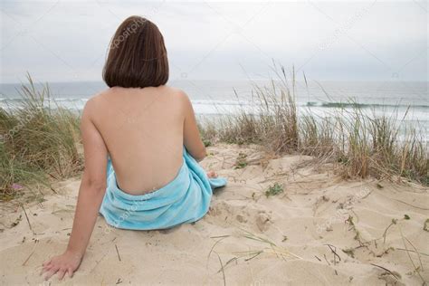 Pretty Woman Nude Sitting From The Back On Beach Stock Photo Oceanprod