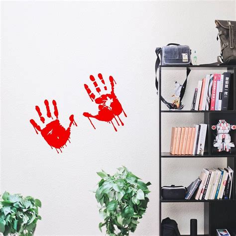 A Room With A Red Painted Hand On The Wall Decords