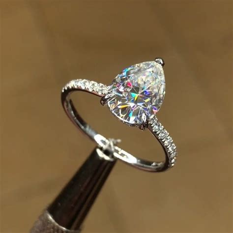 Pear Shape Diamond Engagement Ring With Dainty Diamond Band