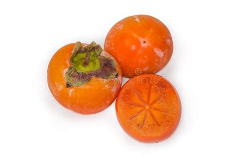 Whole And Cut Across Oriental Persimmons On A White Background Stock