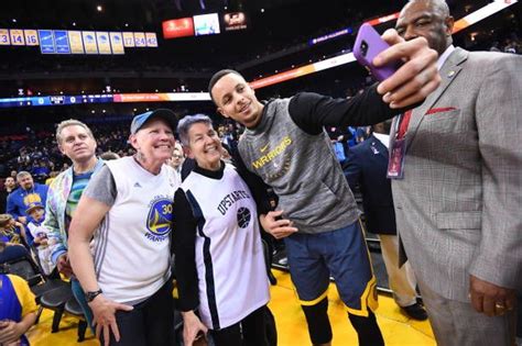 Stephen Curry Of The Golden State Warriors Takes A Photo With Fans