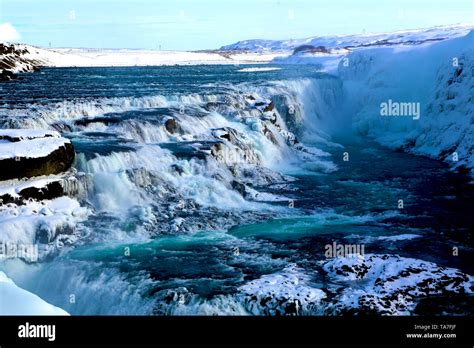 Gullfoss Waterfall With Blue Water In Winter At Golden Circle In