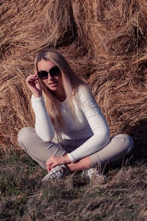 Beautiful Blonde Woman With Sunglasses Enjoying Sun In Fall Setting Travel Lifestyle Stock Photo