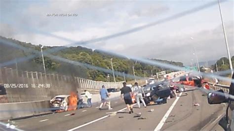 Video Dashcam Video Captures Woman Rescued From Burning Car After