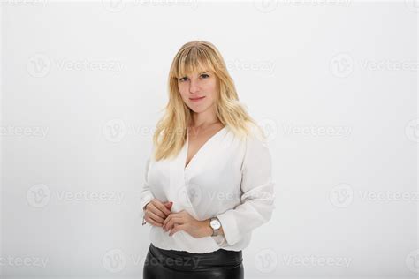 Close Up Portrait Of Blonde Girl Model In White Wool Sweater On White Background In Studio
